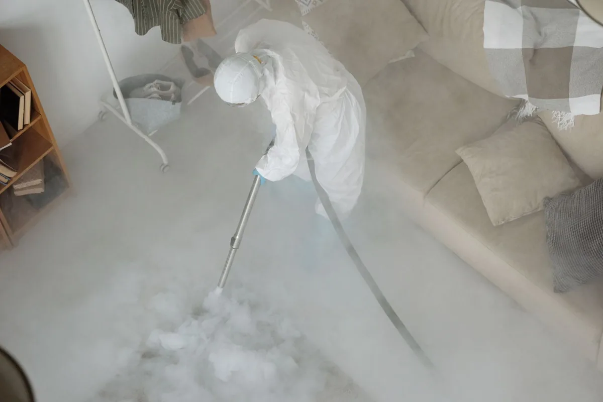 Biohazard cleanup technician in protective equipment, Algodones, NM